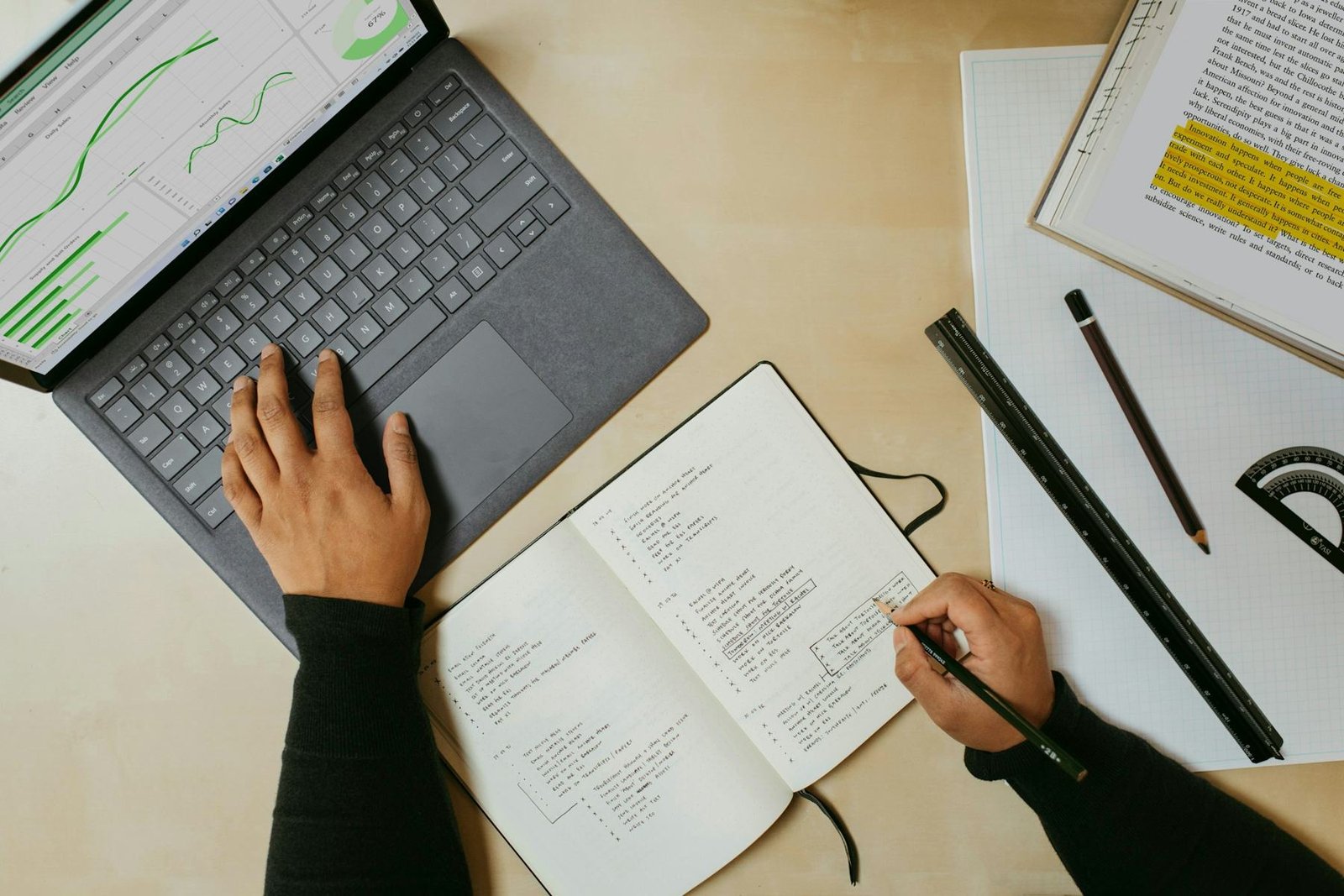 Notes and a laptop on a desk during an audit