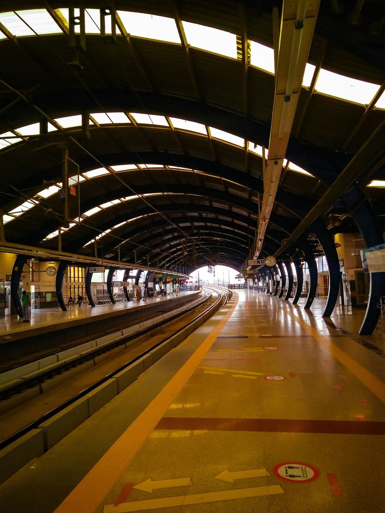 A Delhi Metro platform at golden hour